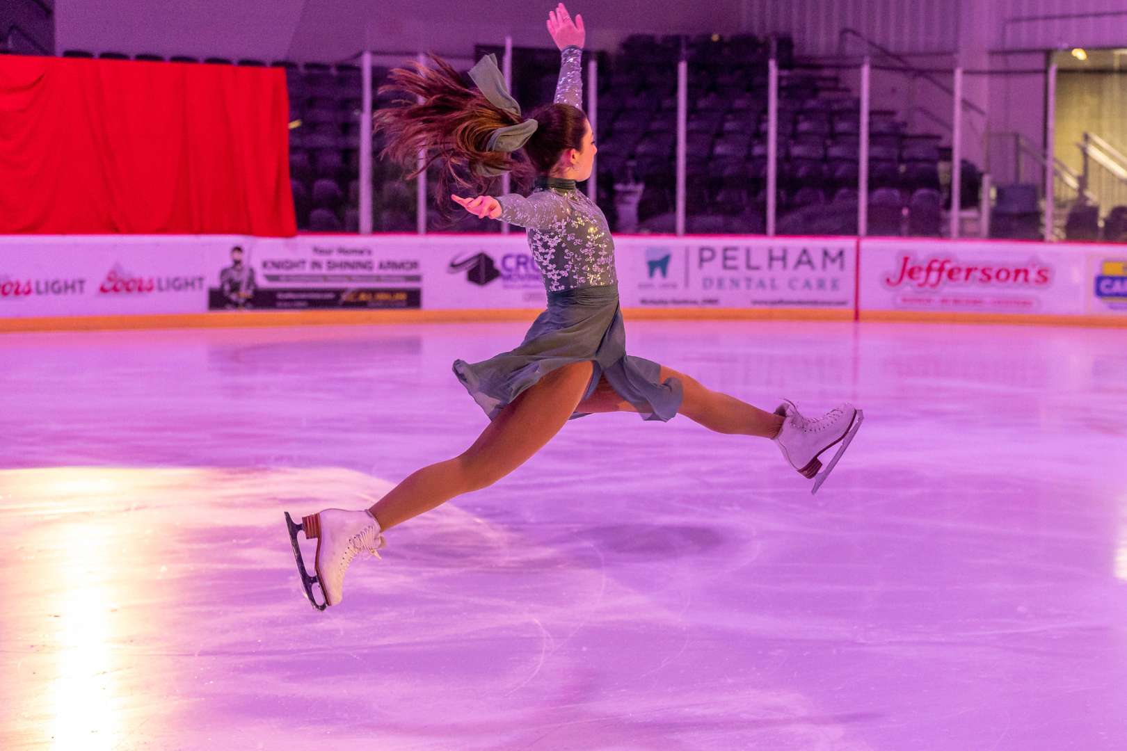 Photo of Figure skater jumping on the ice rink in Pelham