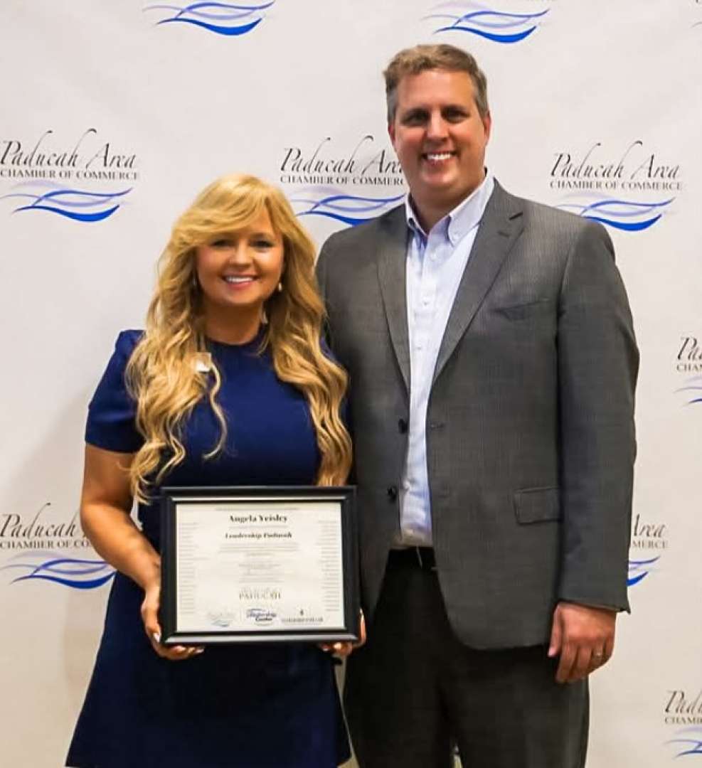 Photo of Sales manager of Paducah Convention Center Angela being named a Kentucky Colonel for her statewide leadership