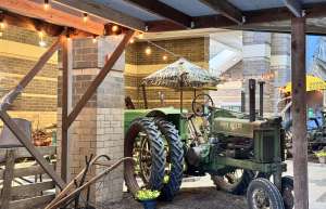 Thumbnail photo of Image of a John Deere tractor at the Gathering of The Green Event at the River Center