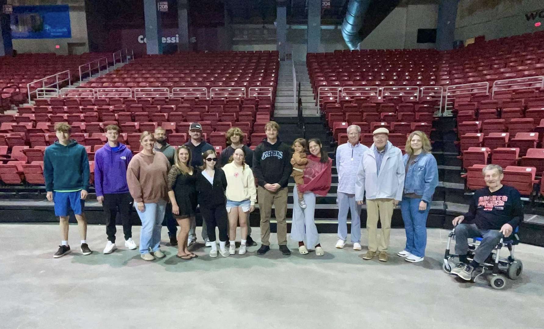 Photo of Carson Dalland at the Einheusen Arena with guests and co-workers