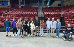 Thumbnail photo of Carson Dalland at the Einheusen Arena with guests and co-workers