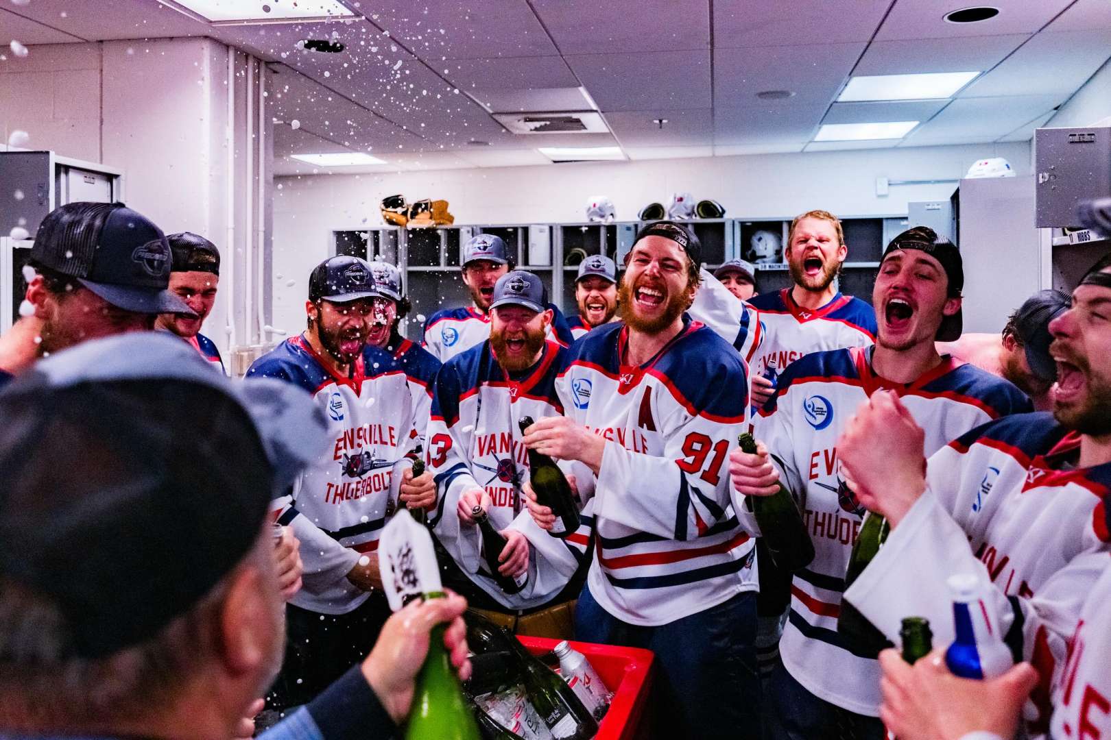 Photo of Evansville Thunderbolts team 2026 SPHL Champions celebrate victory in locker room