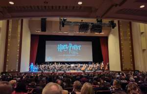 Thumbnail photo of Harry Potter In Concert show with an Orchestra on stage POV Audience