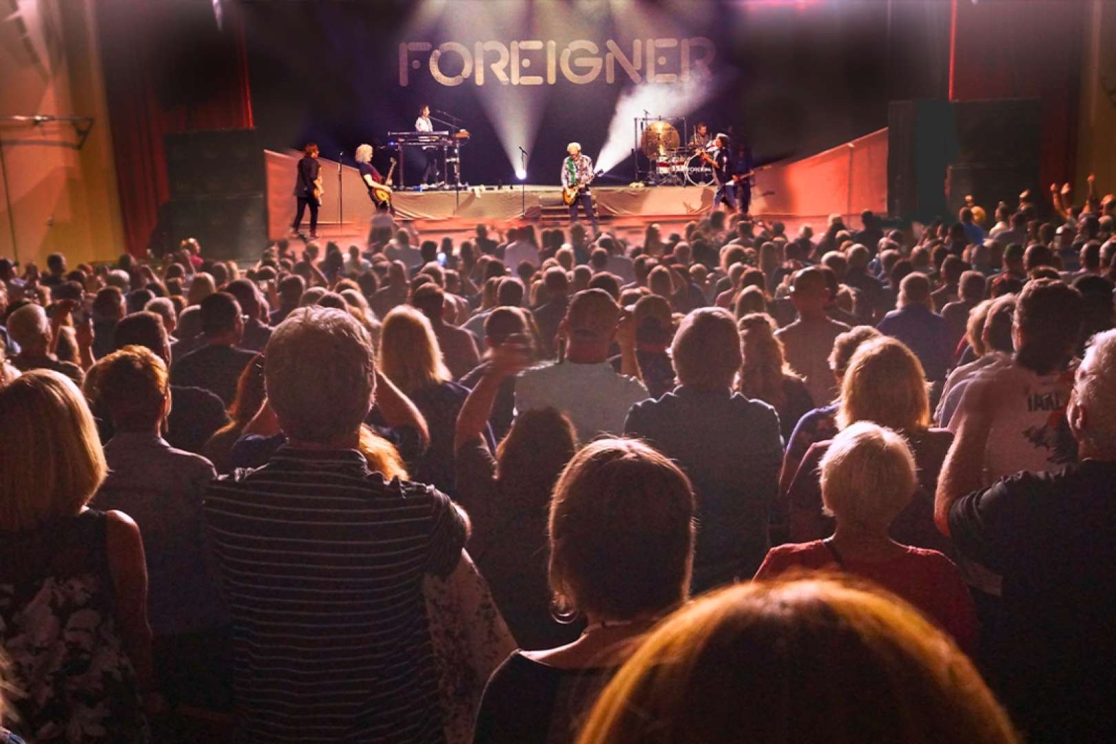 Photo of Audience at the Aiken Theatre watching the band Foreigner perform on stage