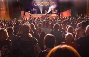Thumbnail photo of Audience at the Aiken Theatre watching the band Foreigner perform on stage
