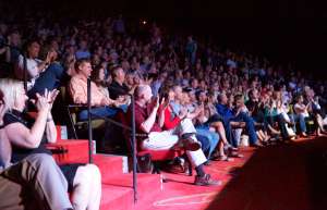 Thumbnail photo of Audience seated in Ames Center Masquerade Theatre clapping