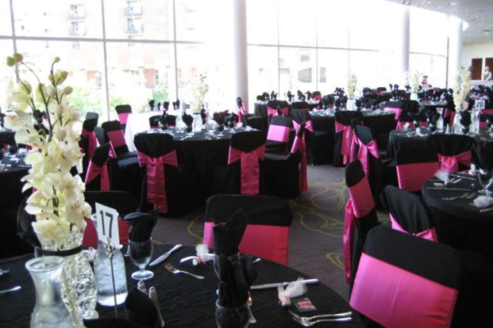 Photo of Lobby set up with tables ornately decorated for a gala