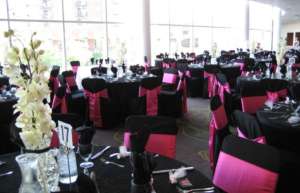 Thumbnail photo of Lobby set up with tables ornately decorated for a gala