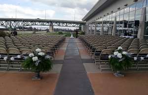 Thumbnail photo of Outdoor plaza set up with chairs for a wedding reception