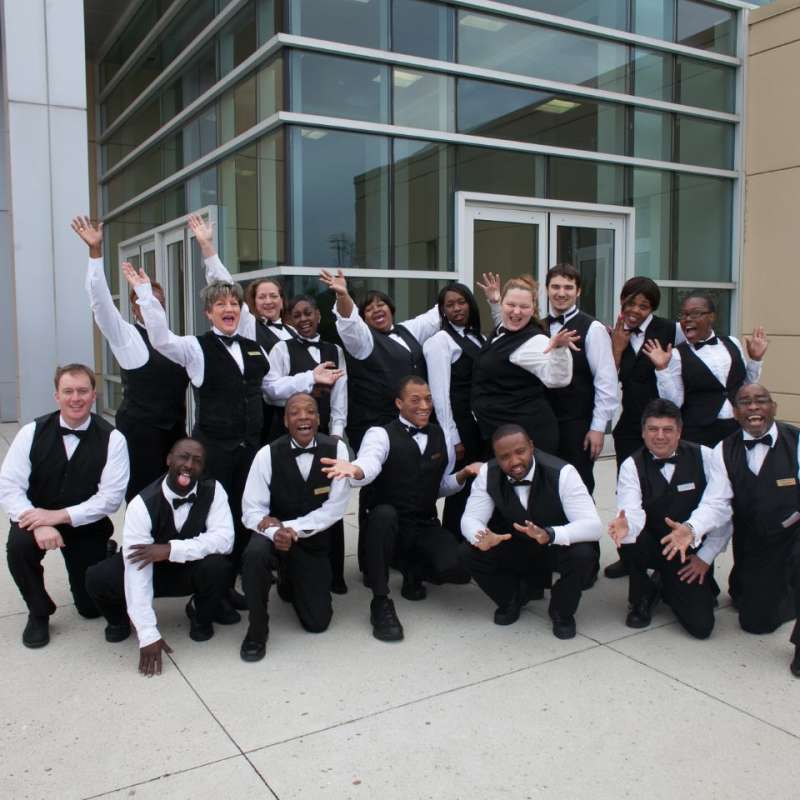 Group photo of VenuWorks employees making funny faces