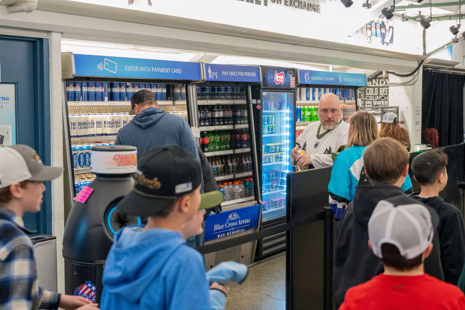 Photo of People shopping in the Amazon Just Walk Out store in Rochester's Blue Cross Arena