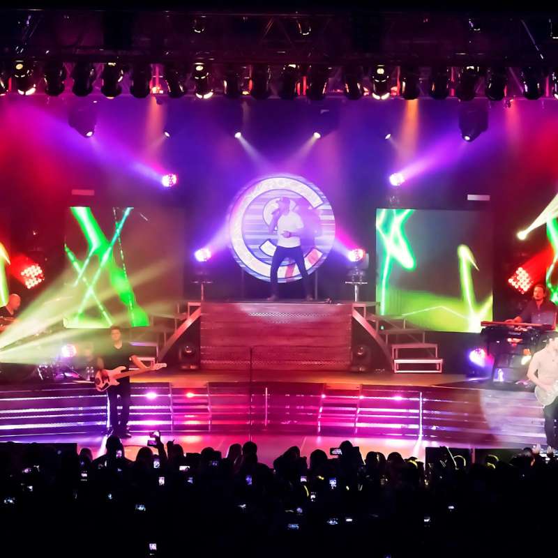 Image of stage with flashing strobe lights from audience POV