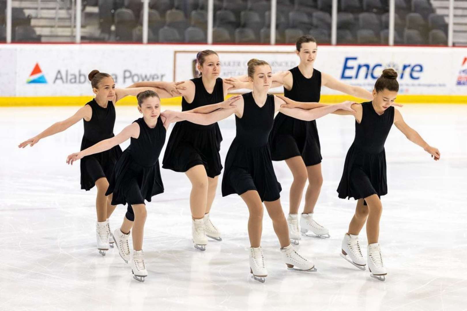 Photo of A team of girls figure skating at Pelham Ice Arena