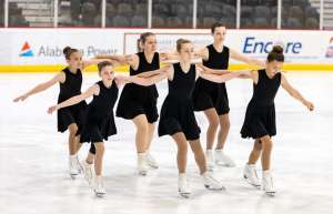 Thumbnail photo of A team of girls figure skating at Pelham Ice Arena