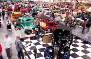 Thumbnail photo of Attendees admiring cars at a car show at the Fresno Convention Center