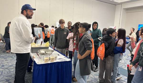 Chef Stephen at the Chesapeake Public Schools WOW Event talking to students about working in hospitality