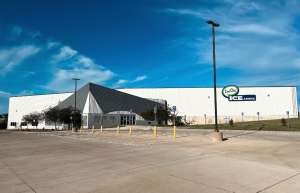 Thumbnail photo of Exterior shot of ImOn Ice Arena and parking lot