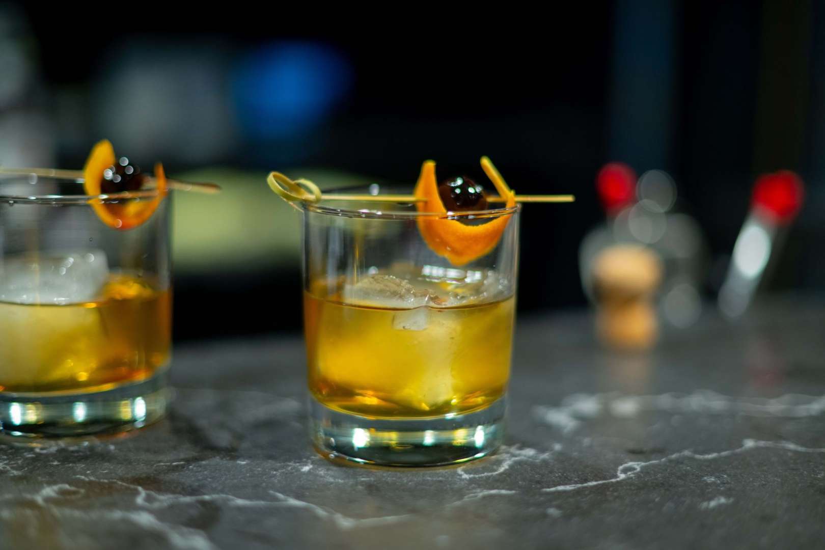 Photo of 2 old fashioned cocktails sit on the bar at the Ingersoll