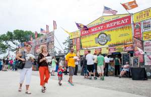 Thumbnail photo of McGrath Amphitheatre food concessions, people walking by eating