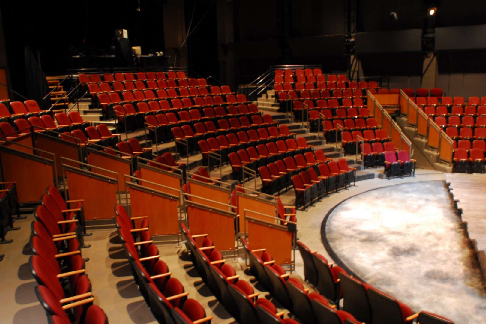 Photo of Empty theatre showing red theater seats
