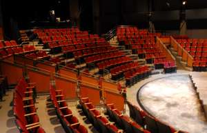 Thumbnail photo of Empty theatre showing red theater seats