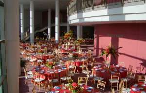 Thumbnail photo of Lobby of the North Shore Center for the Arts set up for a gala dinner with round tables