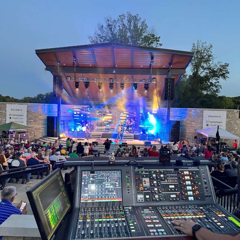 Image of outdoor concert from POV of sound booth