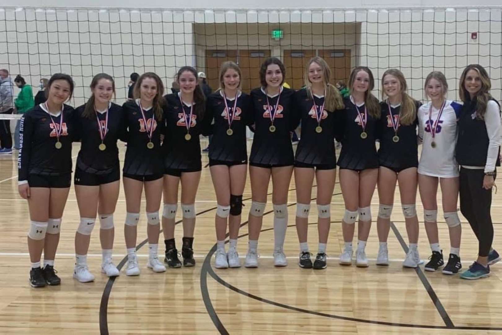 Photo of Girl's Volleyball Winning Team posing for photo