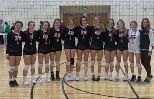 Thumbnail photo of Girl's Volleyball Winning Team posing for photo