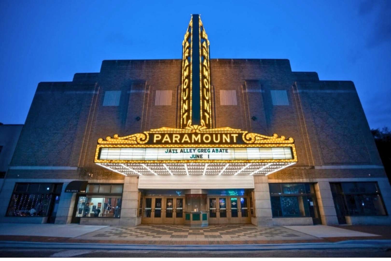 Photo of A stunning exterior shot captures the illuminated Paramount Marquee in Ashland, KY, elegantly promoting an upcoming jazz concert.
