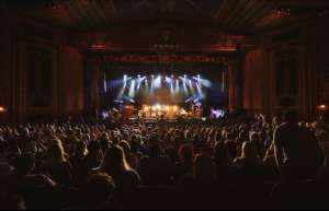 Thumbnail photo of A interior shot of an audience enjoying a concert at the Paramount Arts Center in Ashland KY from POV Audience