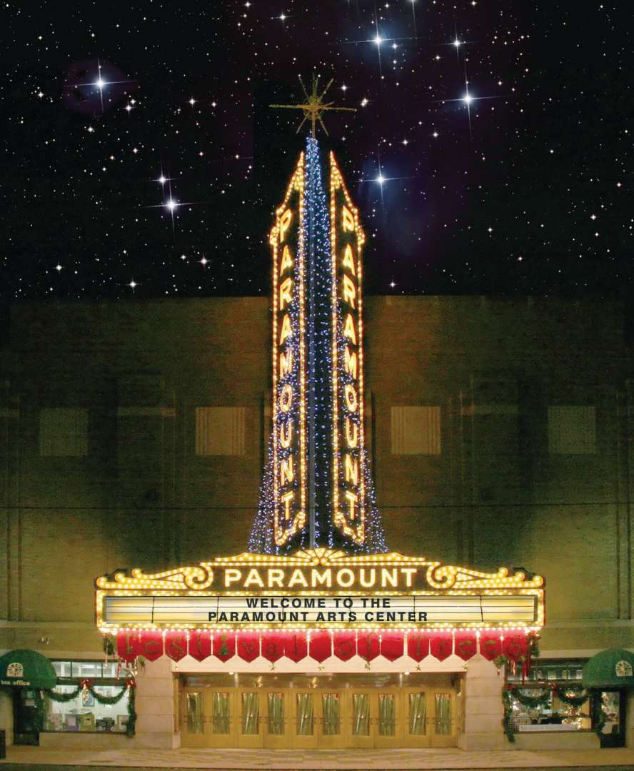 Photo of A shot of the illuminated Paramount Arts Center Marquee in a winter sky with the words welcome to the Paramount displayed on the marquee