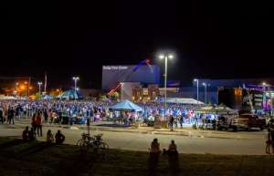 Thumbnail photo of BVC Parking Lot Ragbrai Event packed with people