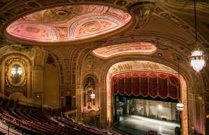 Thumbnail photo of The historic ornate ceiling and architectural splendor of the theater lit up