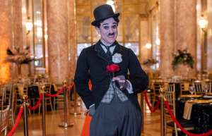 Thumbnail photo of An actor dressed up as Charlie Chaplin at the Rialto Square 100th anniversary gala