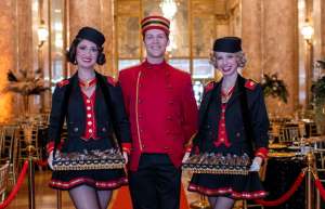 Thumbnail photo of 3 actors dressed in 1920s clothes as usher and cigarette girls a the Rialto Square theatre
