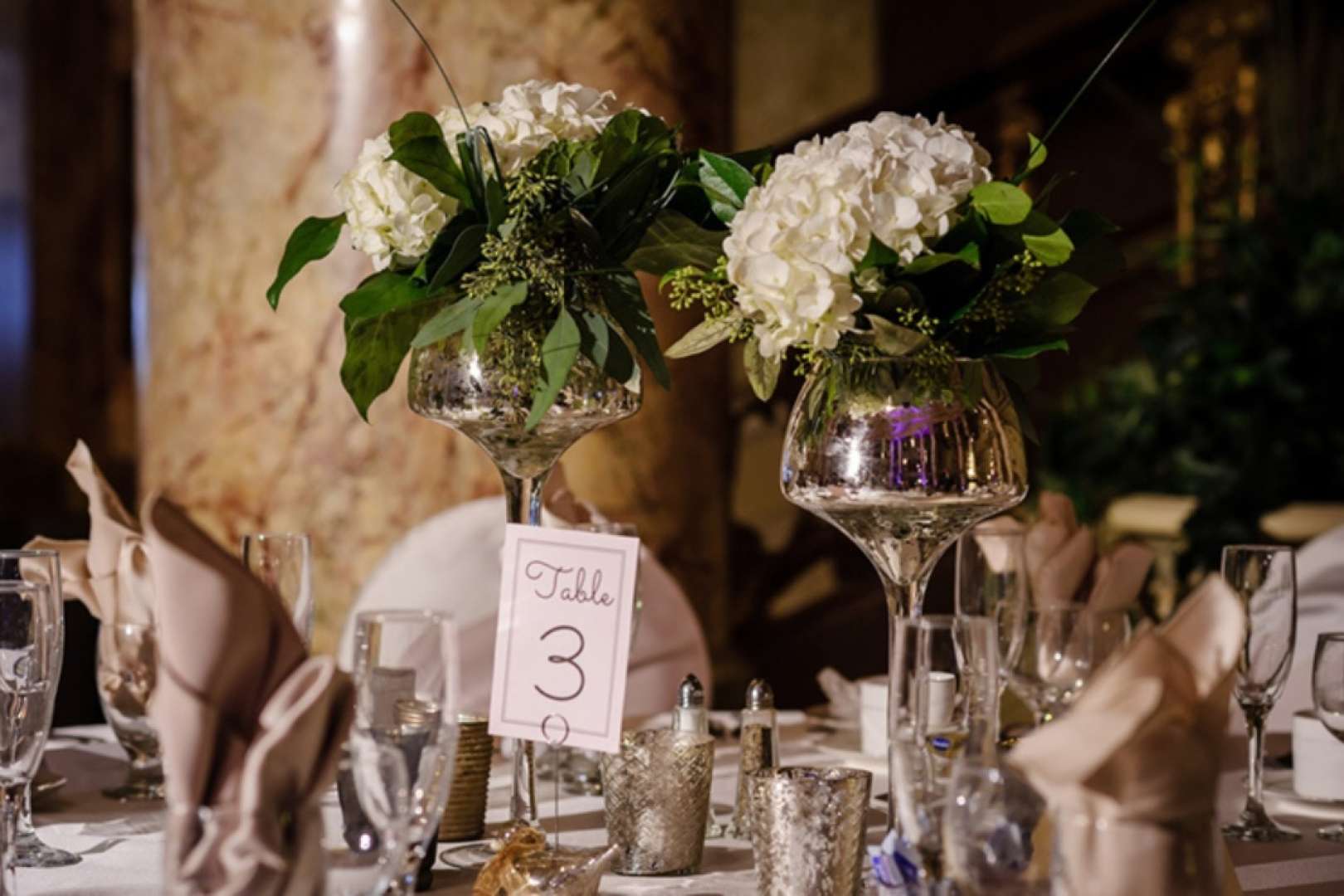 Photo of close shot of table setting for a wedding banquet