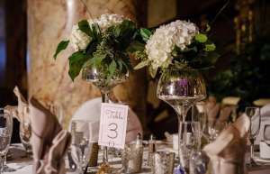 Thumbnail photo of close shot of table setting for a wedding banquet