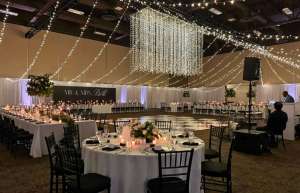 Thumbnail photo of River Center main hall set up for a wedding with round tables
