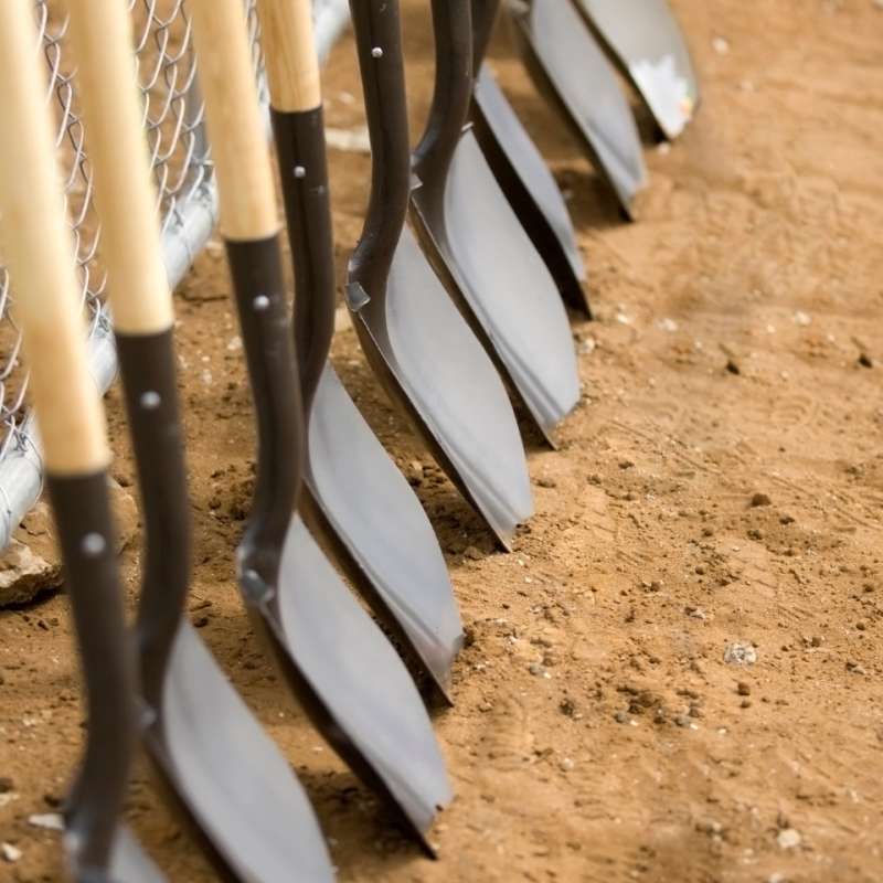Shovels lined up about to break dirt for venue construction