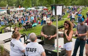 Thumbnail photo of Staff taking tickets at outdoor event
