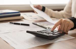 Thumbnail photo of calculating finances