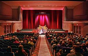 Thumbnail photo of A wedding taking place in the main hall of the Topeka Performing Arts Center