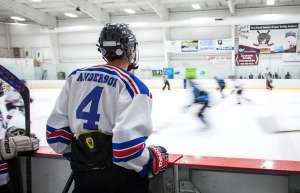 Thumbnail photo of hockey player looking on at the ice hockey game at the Toyota Arena