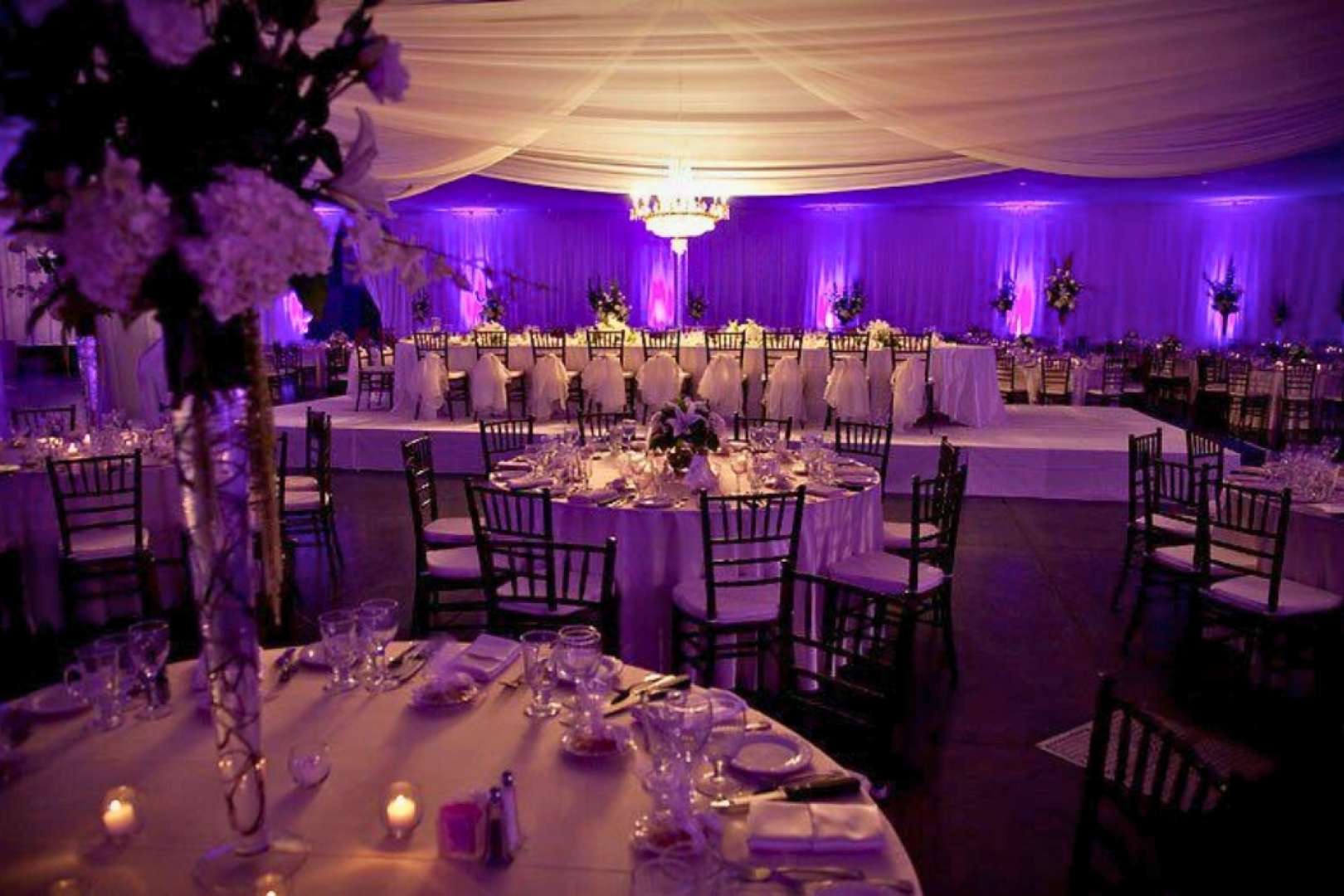 Photo of Valdez hall set up for a wedding banquet with top table in view