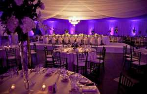 Thumbnail photo of Valdez hall set up for a wedding banquet with top table in view