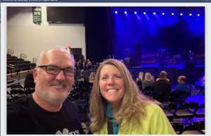 Thumbnail photo of U.S Veteran Chris with a friend attending the Rock of Ages show at the Oshkosh Arena