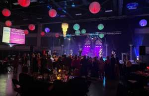 Thumbnail photo of Band on stage at Vicksburg Convention center from audience POV