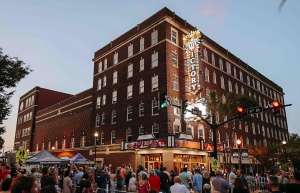Thumbnail photo of Victory Theatre a crowd gathered outside to see the unveiling of the new historic marquee