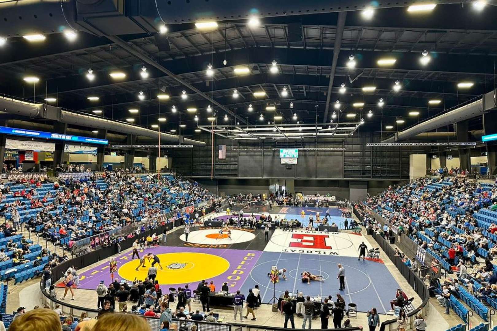Photo of A Wrestling tournament in progress at the HCU Arena in Park City KS
